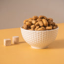 Dry-roasted Truffle Cashews with black truffle flavor – crunchy, creamy, savory vegan snack.