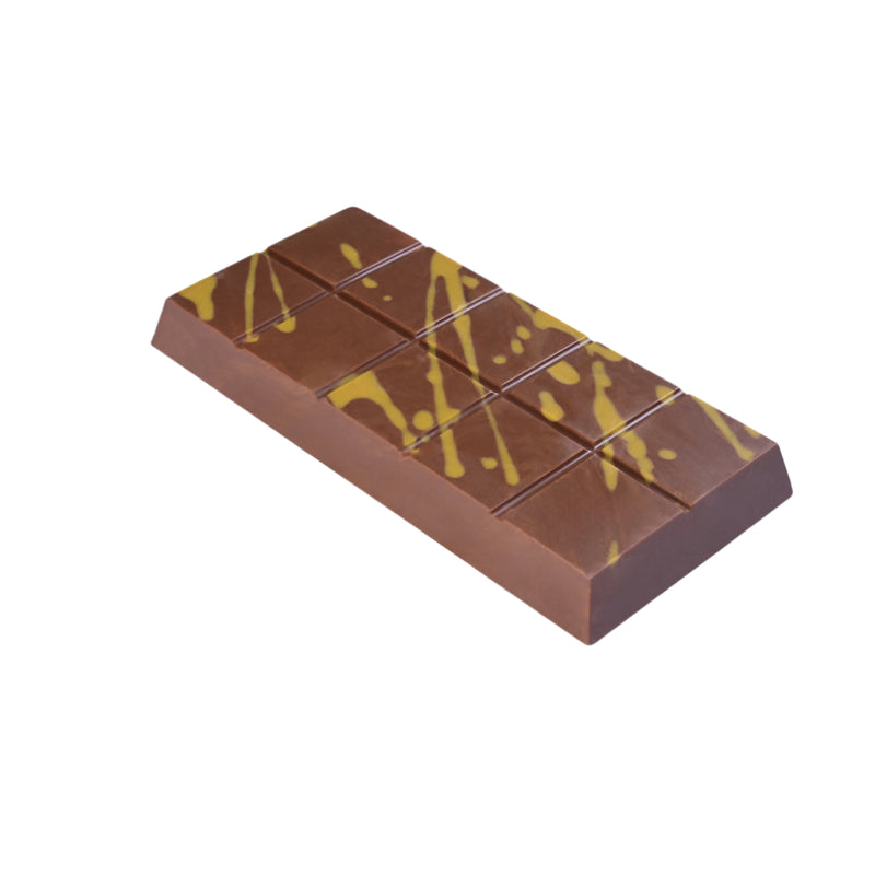 Chocolate bar featuring a spiced speculoos biscuit cream filling with biscuit crumbs, surrounded by broken pieces and whole biscuits.